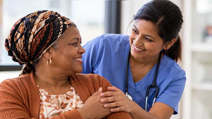 Healthcare professional supporting a patient